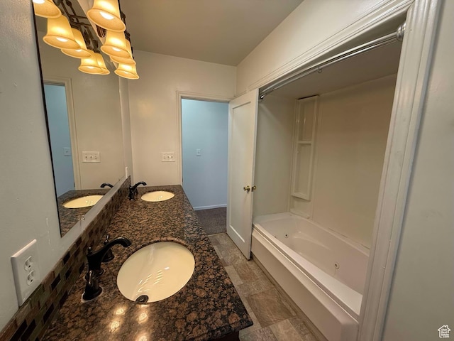 bathroom featuring vanity and shower / bathtub combination