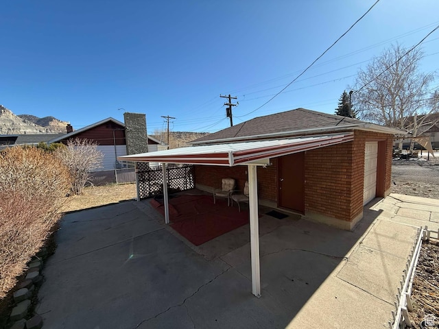 view of patio / terrace featuring a garage