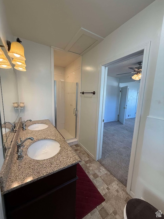 bathroom featuring vanity and an enclosed shower