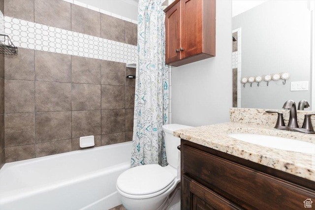 full bathroom featuring vanity, shower / bathtub combination with curtain, and toilet