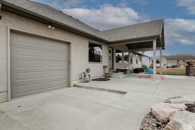 view of patio / terrace with a garage