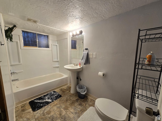 full bathroom featuring a textured ceiling, visible vents, toilet, shower / bath combination, and baseboards