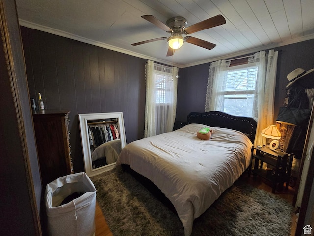 bedroom with crown molding and ceiling fan