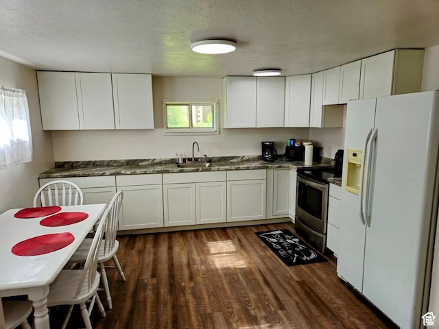 928 Monroe St, Montpelier, ID 83254 - kitchen with white cabinets, white refrigerator with ice dispenser, and electric range