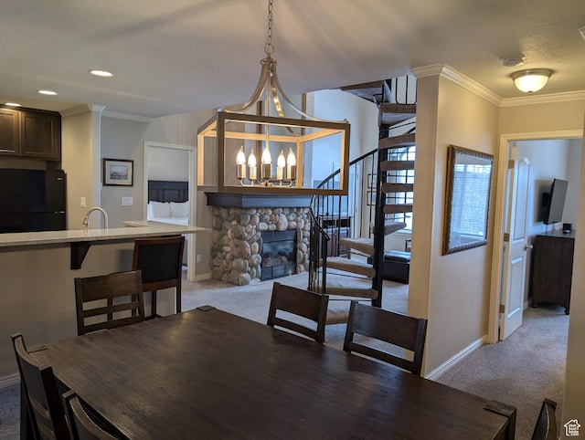 798 N 800 W Unit 8, Midway, UT 84049 - dining room with a stone fireplace, sink, crown molding, a chandelier, and carpet
