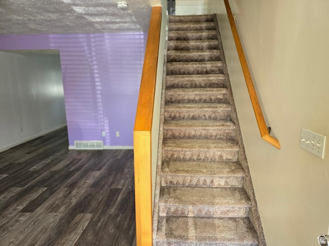1305 Monroe Blvd Unit 15, Ogden, UT 84404 - staircase with a textured ceiling, visible vents, and wood finished floors