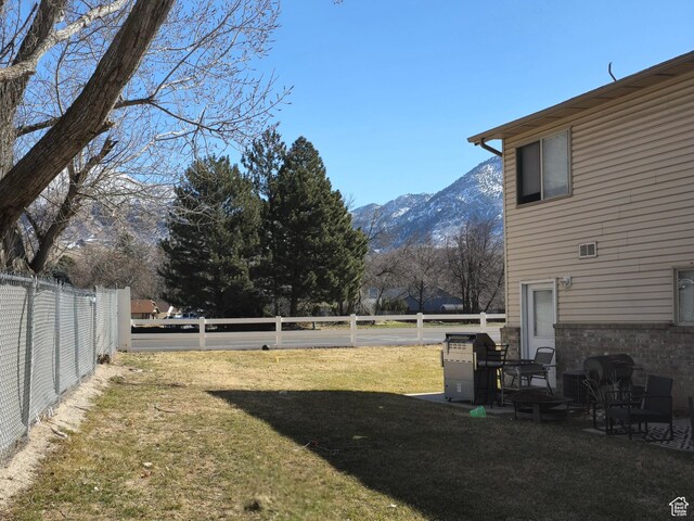 1305 Monroe Blvd Unit 15, Ogden, UT 84404 - view of yard featuring fence and a mountain view