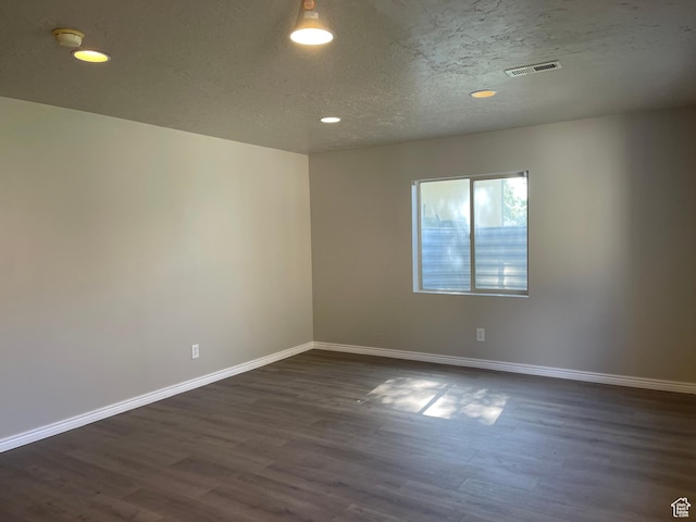 909 E Rosebud Ct, Draper, UT 84020 - empty room with dark hardwood / wood-style floors and a textured ceiling