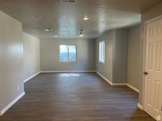 909 E Rosebud Ct, Draper, UT 84020 - unfurnished room featuring dark hardwood / wood-style floors and a textured ceiling