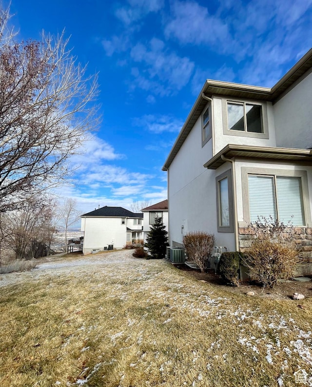 909 E Rosebud Ct, Draper, UT 84020 - view of property exterior featuring central AC unit and a lawn