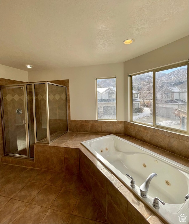 909 E Rosebud Ct, Draper, UT 84020 - bathroom with tile patterned flooring, plus walk in shower, and a textured ceiling