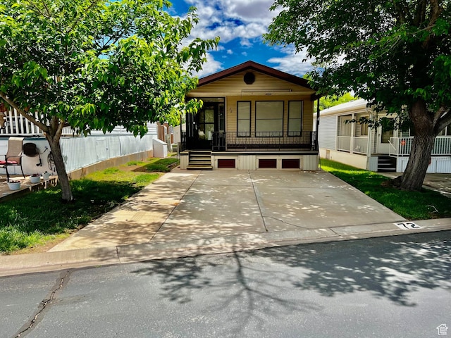 1150 W Red Hills Pkwy Unit 72, Washington, UT 84780 - shotgun-style home featuring covered porch