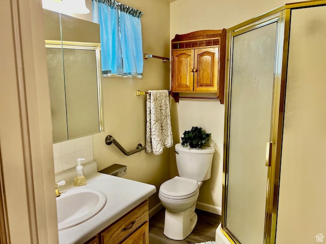 1150 W Red Hills Pkwy Unit 72, Washington, UT 84780 - bathroom featuring vanity, wood finished floors, tasteful backsplash, and a shower stall