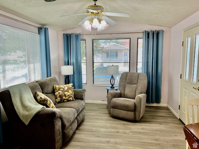 1150 W Red Hills Pkwy Unit 72, Washington, UT 84780 - interior space with a textured ceiling, baseboards, vaulted ceiling, and a healthy amount of sunlight