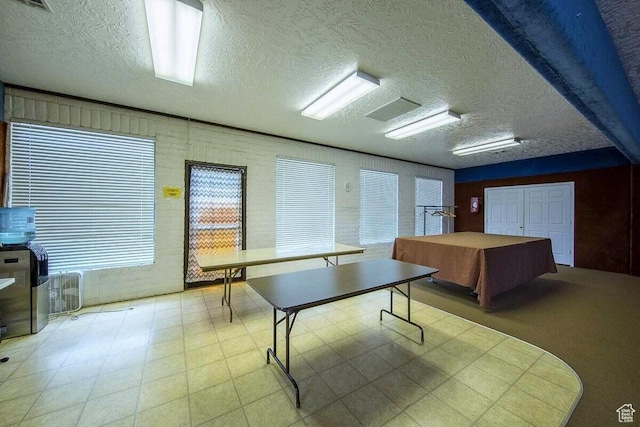 1150 W Red Hills Pkwy Unit 72, Washington, UT 84780 - rec room featuring a textured ceiling, visible vents, and tile patterned floors