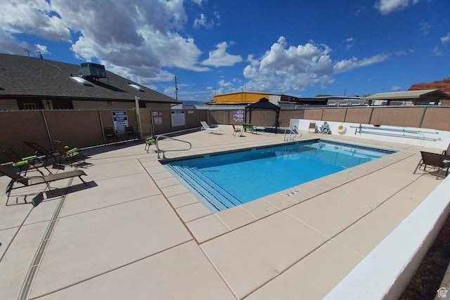 1150 W Red Hills Pkwy Unit 72, Washington, UT 84780 - community pool featuring fence, central AC unit, and a patio area