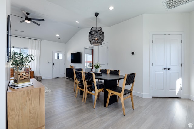 dining area with a healthy amount of sunlight, light wood-style floors, and visible vents