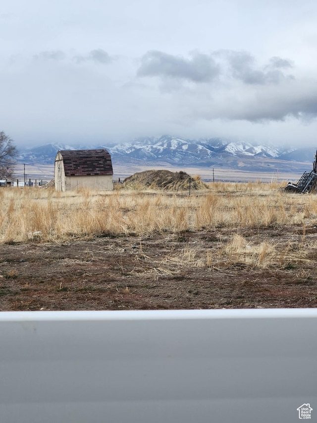 605 N Kay Ln, Tooele, UT 84074 - view of yard featuring a storage unit, a mountain view, and a rural view