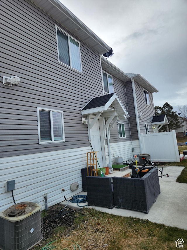 605 N Kay Ln, Tooele, UT 84074 - back of house with central AC, outdoor lounge area, and a patio area