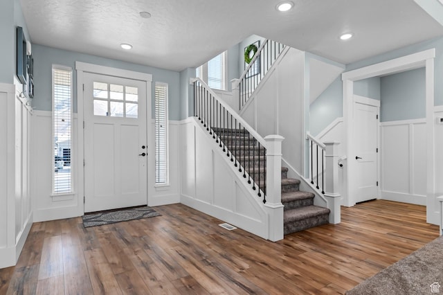 1426 S 1450 W, Mapleton, UT 84664 - foyer entrance with a wainscoted wall, stairway, hardwood / wood-style floors, a decorative wall, and recessed lighting