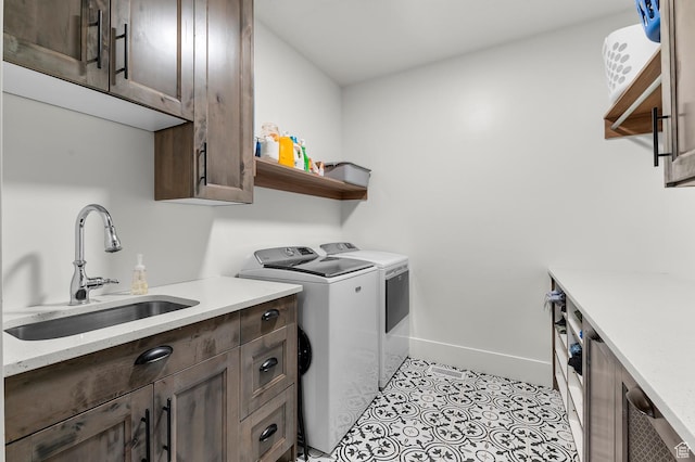 1426 S 1450 W, Mapleton, UT 84664 - washroom featuring cabinet space, light tile patterned floors, baseboards, washer and dryer, and a sink