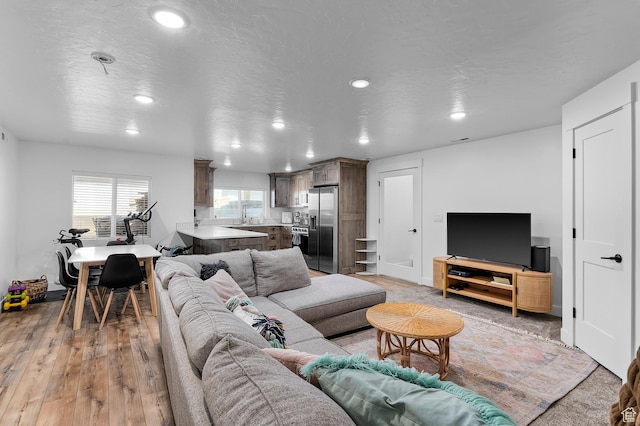 1426 S 1450 W, Mapleton, UT 84664 - living area with light wood-type flooring, a textured ceiling, and recessed lighting