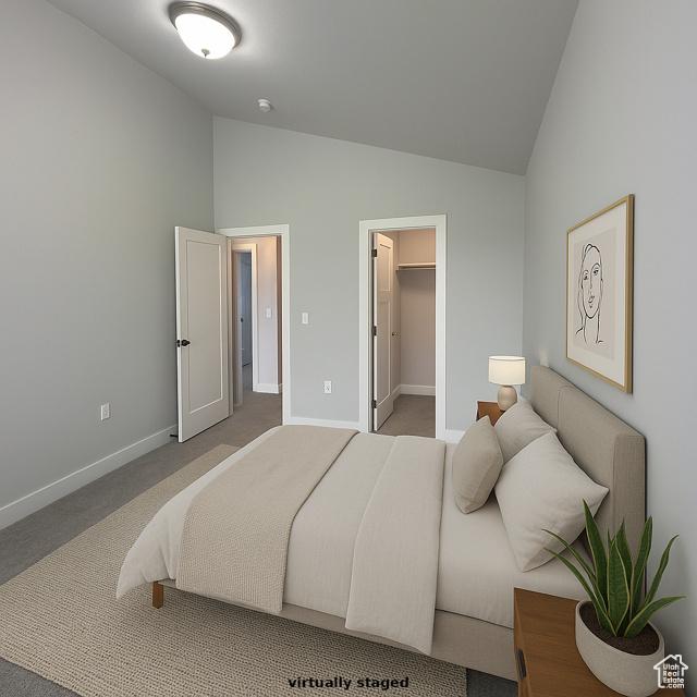 545 E Petersen Pkwy, South Weber, UT 84405 - bedroom with baseboards, a spacious closet, carpet floors, and high vaulted ceiling