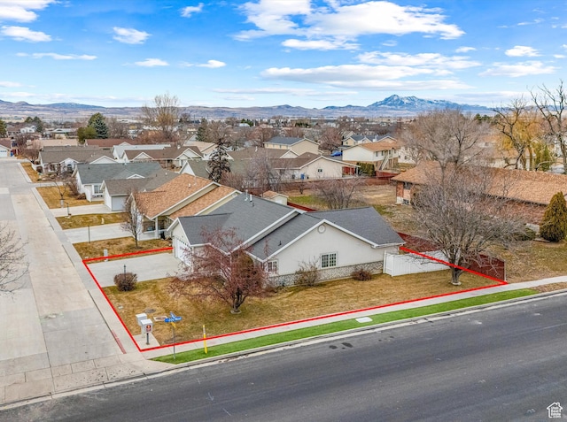 birds eye view of property featuring a mountain view