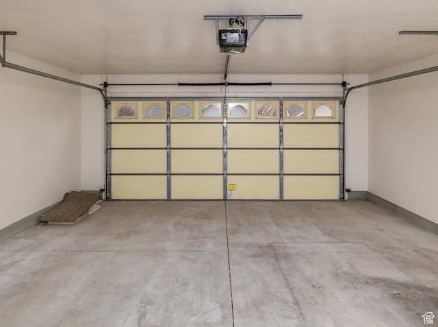 garage featuring a garage door opener