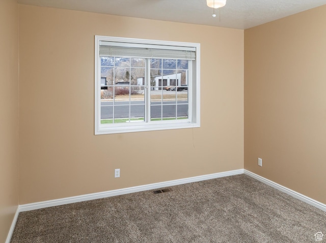 unfurnished room featuring carpet flooring