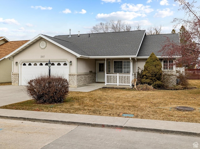ranch-style house with a garage, covered porch, and a front lawn