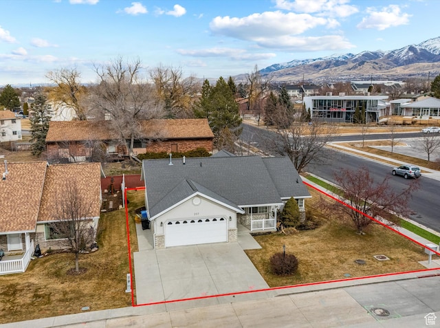 birds eye view of property featuring a mountain view