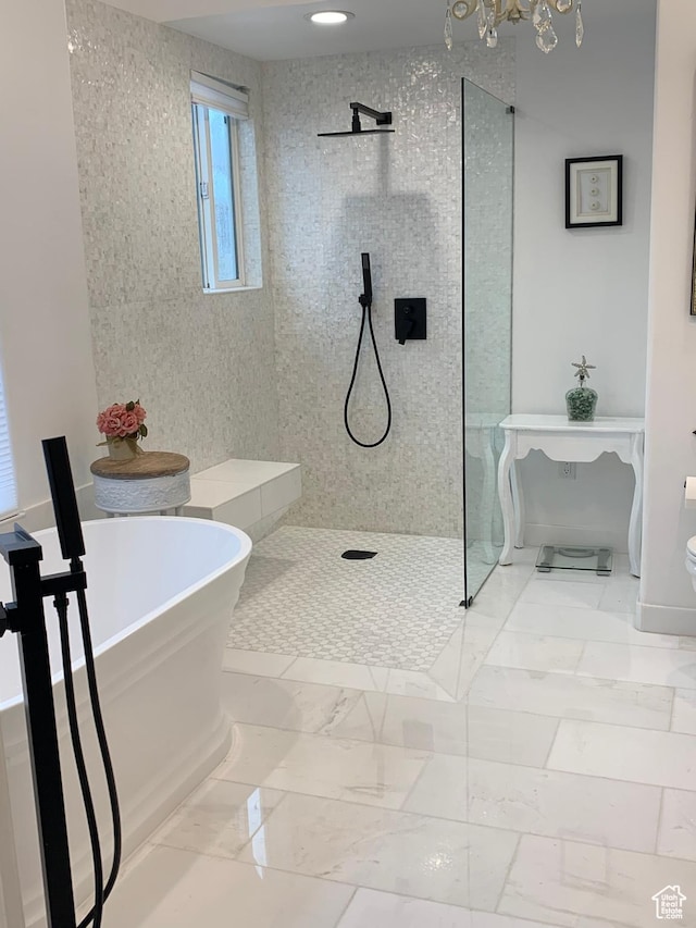 14139 S Radial Ln, Draper, UT 84020 - bathroom with a freestanding tub, a walk in shower, toilet, and marble finish flooring