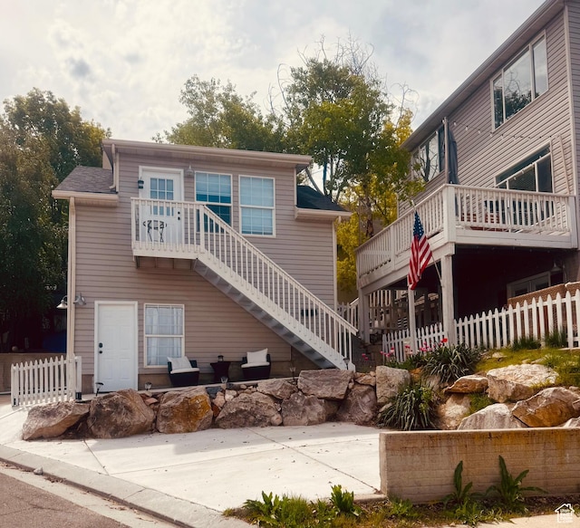 14139 S Radial Ln, Draper, UT 84020 - view of front of property with stairs, a wooden deck, and a patio area