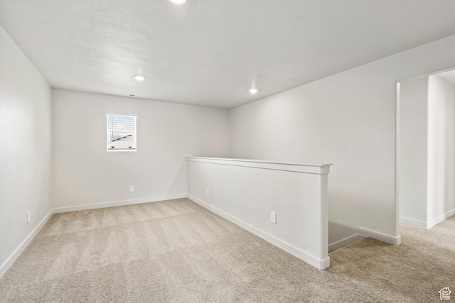 basement with carpet, baseboards, and recessed lighting