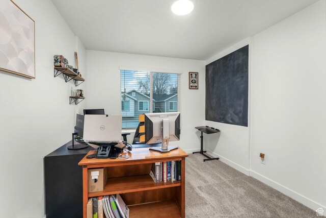 home office with carpet flooring