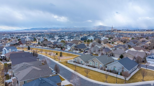 birds eye view of property with a mountain view