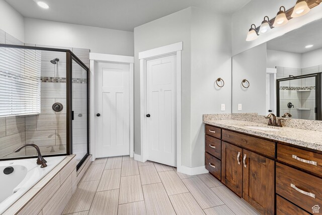 10743 S Autumn Wind Way S, Jordan, UT 84009 - bathroom featuring vanity and independent shower and bath