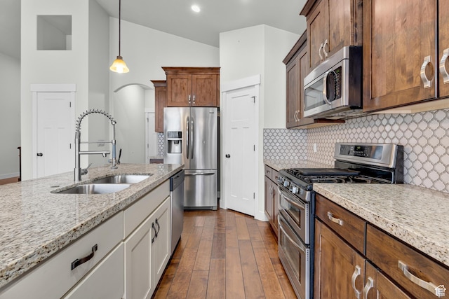 10743 S Autumn Wind Way S, Jordan, UT 84009 - kitchen featuring dark wood-type flooring, sink, white cabinetry, light stone counters, and stainless steel appliances