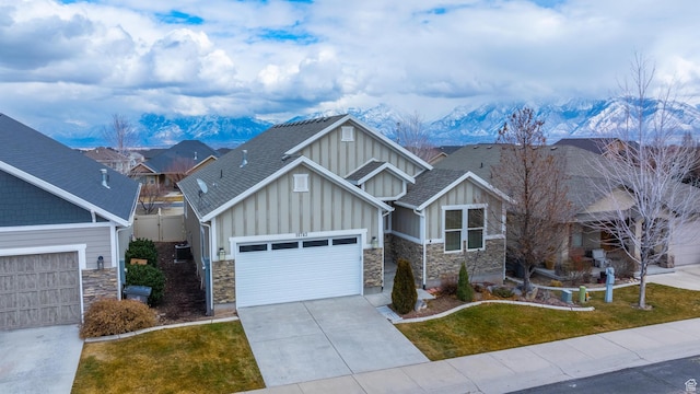 10743 S Autumn Wind Way S, Jordan, UT 84009 - craftsman-style home with a garage, a mountain view, and a front lawn