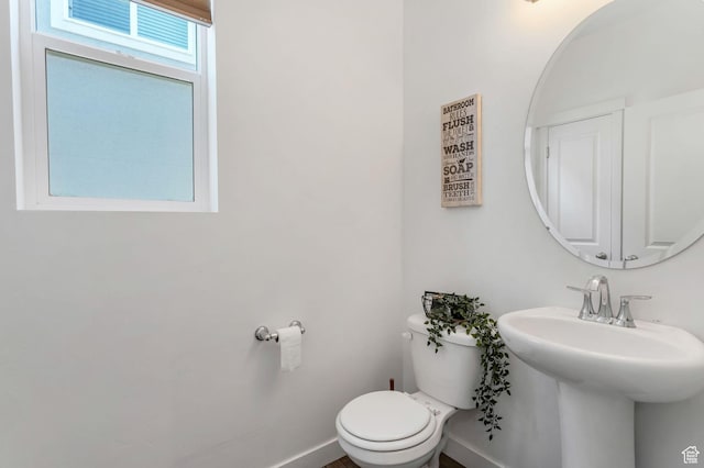 3457 W Hamm Ln, Herriman, UT 84096 - bathroom with toilet, a sink, and baseboards