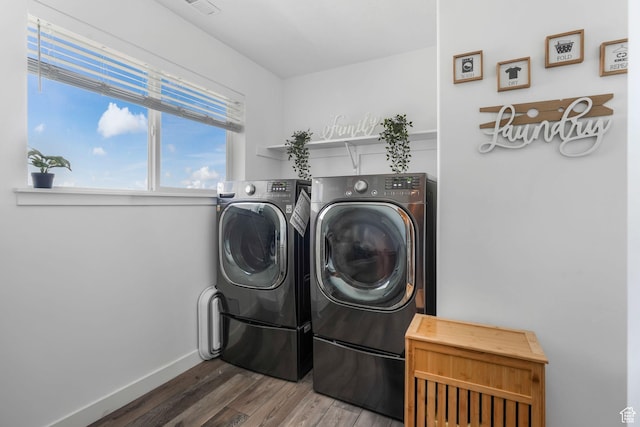 3457 W Hamm Ln, Herriman, UT 84096 - clothes washing area featuring washer and clothes dryer, wood finished floors, and baseboards