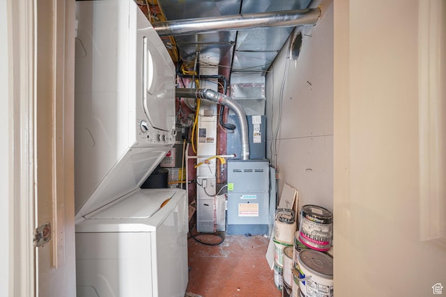 interior space with stacked washer and clothes dryer