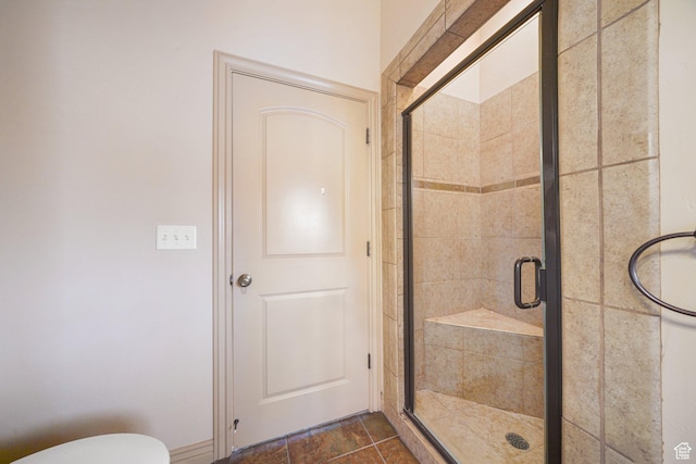 bathroom featuring a shower with door