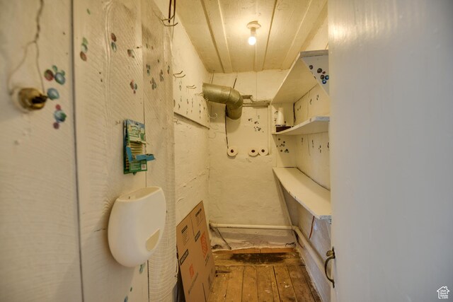 bathroom with hardwood / wood-style flooring