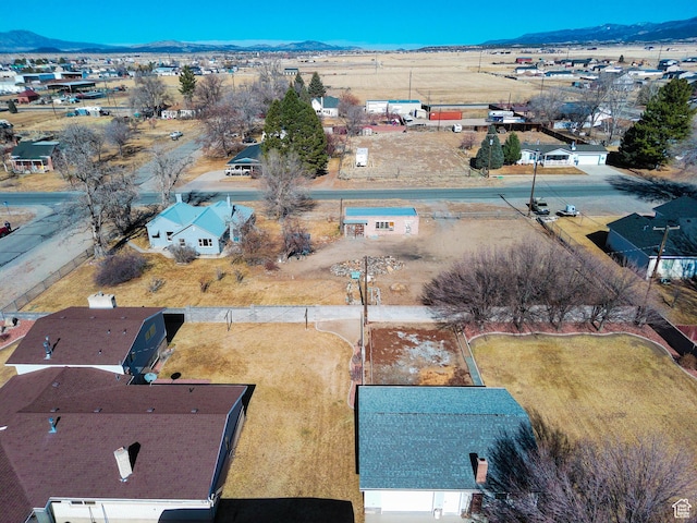 birds eye view of property with a mountain view