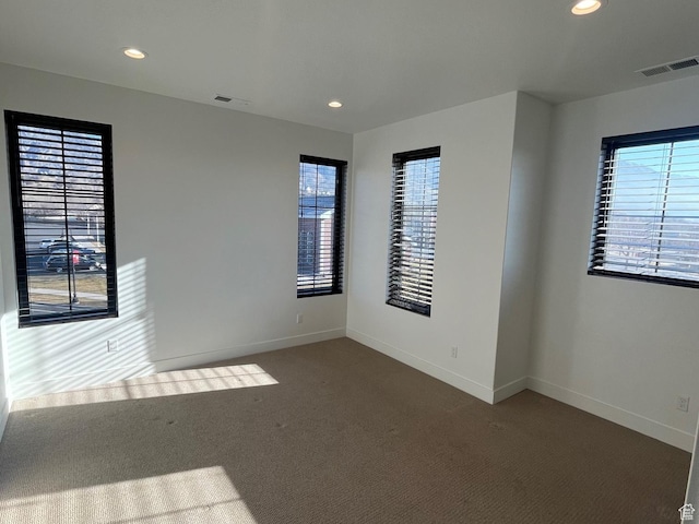 10131 N Redwood, Cedar Hills, UT 84062 - empty room featuring a healthy amount of sunlight and dark carpet