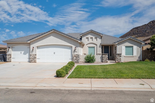 view of front of house featuring a garage and a front yard