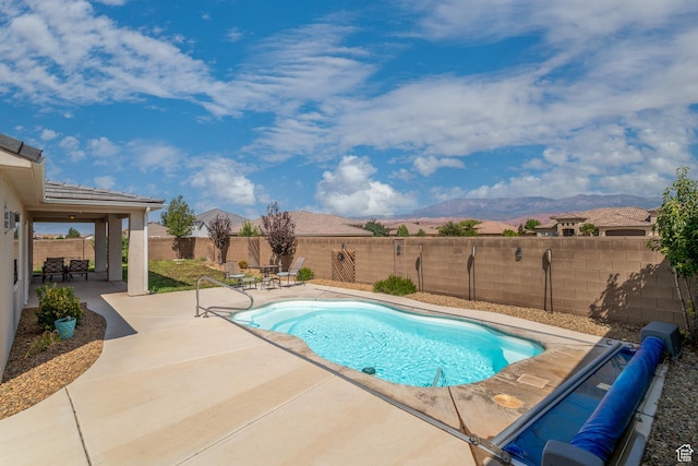 3274 W 2530 S, Hurricane, UT 84737 - view of swimming pool featuring a mountain view and a patio