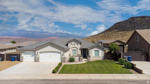 3274 W 2530 S, Hurricane, UT 84737 - view of front of home with a garage, a mountain view, and a front yard